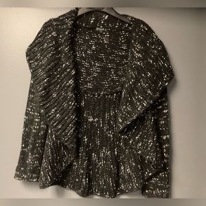 Shiva Novelli black and white Heather variegated beefy knit sweater.